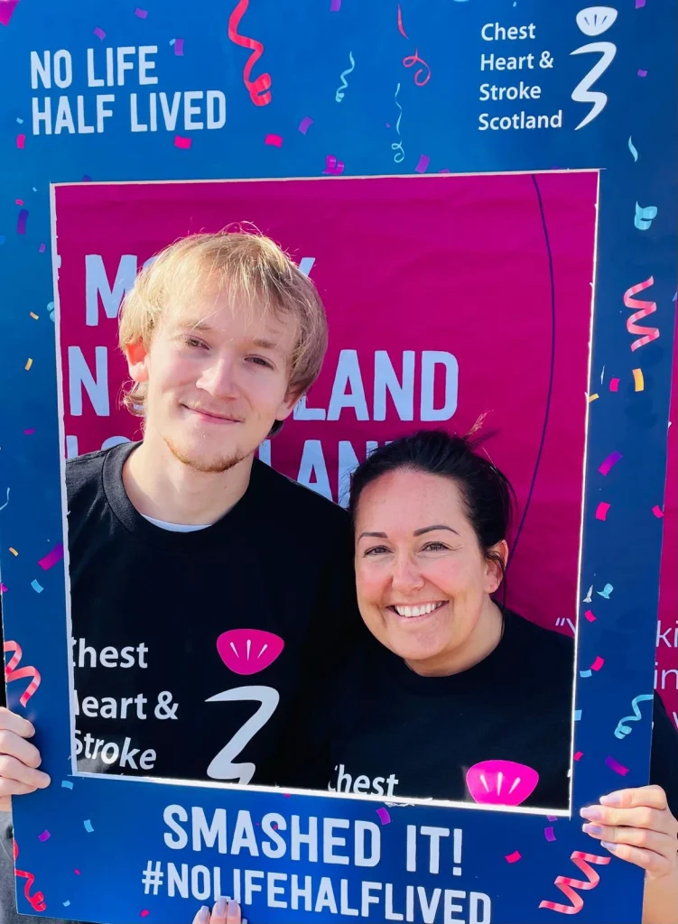 Young Person and Foster Key Worker smiling raising money for charity.