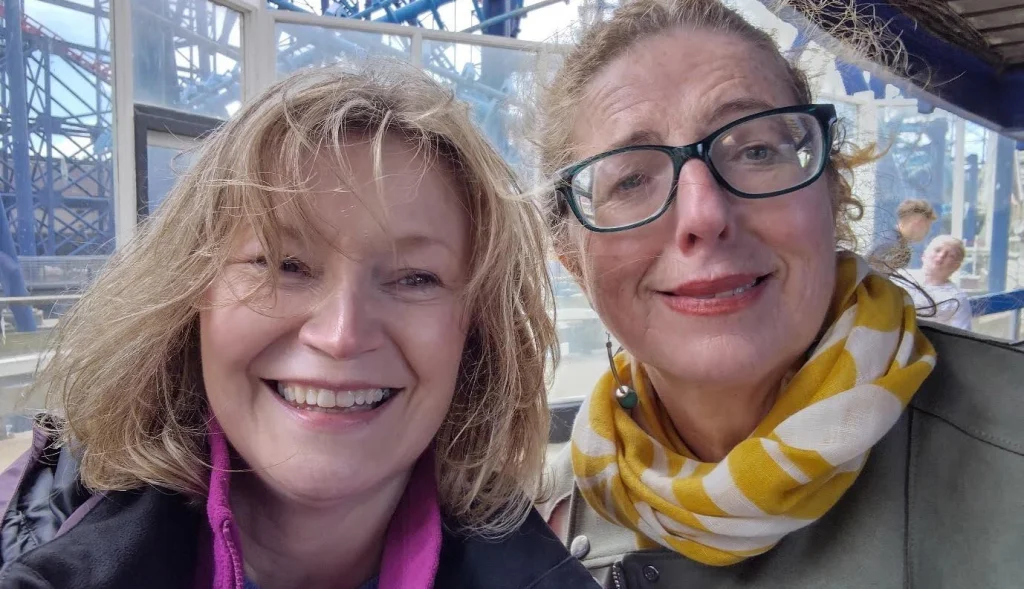 two female foster parents smiling at Blackpool day trip